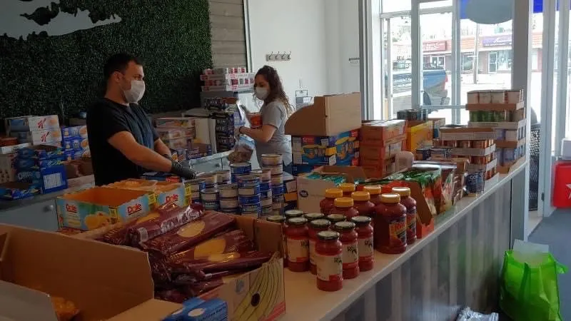 Volunteers sorting supplies in the office